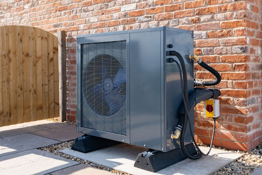 A heat pump unit installed outside of a home.