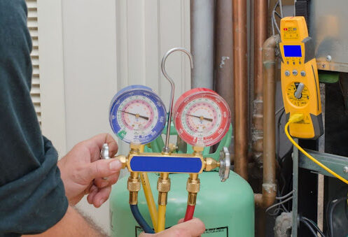 Erica's AC technician checking refrigerant levels.